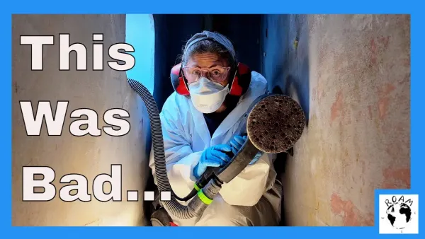 Geri sanding the chain locker and preparing for paint on her cruising catamaran.