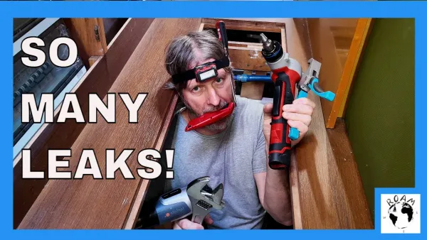 Shawn tooled up to make repairs to the fresh water plumbing system aboard sailing catamaran during extensive boat refit.